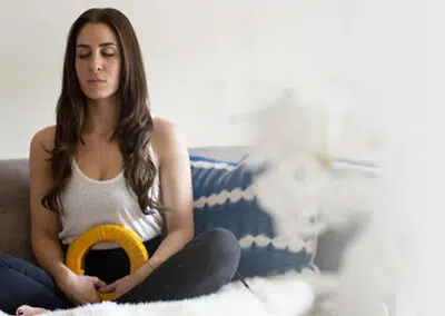 AmpCoil resting on abdomen