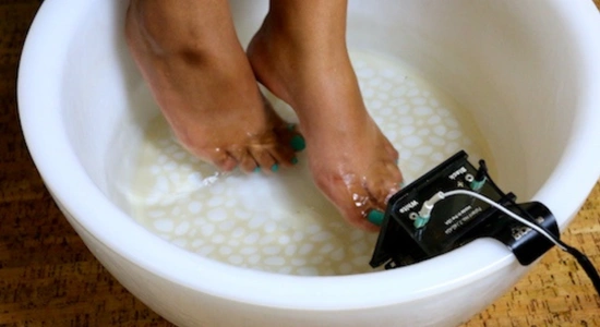womans feet in ionic foot bath for detox in San Luis Obispo